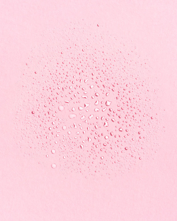 Texture shot of Tidal Rose Hydrating Mist. Tidal Rose is delivers a fine and hydrating mist to tone the skin.  Available for purchase at The Conservationist. 