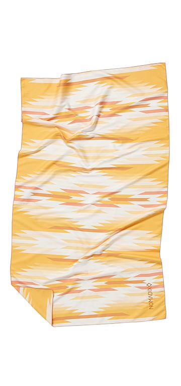 Front facing image of yellow, salmon, white and gold eco-friendly tribal pattern towel. Available for purchase on The Conservationist.