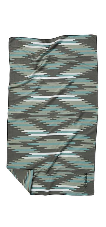 Front facing image of green, blue, white and grey eco-friendly tribal pattern towel. Available for purchase on The Conservationist.