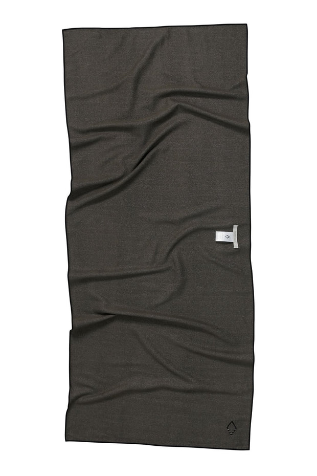 Back Facing image of Northwest Nomadix beach towel- solid grey print. Available for purchase on The Conservationist. 